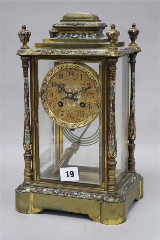 An enamel four glass clock with mercury pendulum